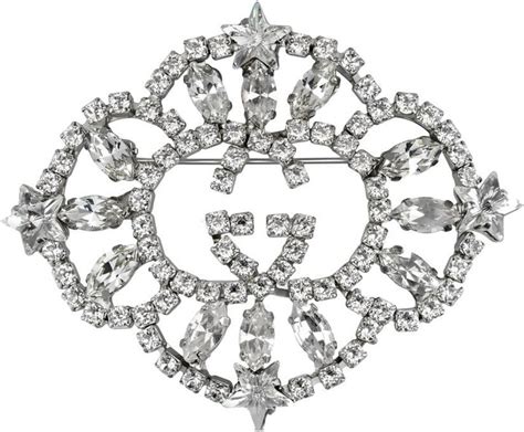 Interlocking G crystal star brooch 